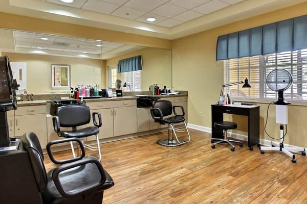 Beauty salon area with styling chairs and equipment