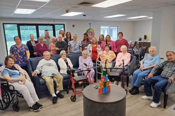 Residents and staff gathered in a common area