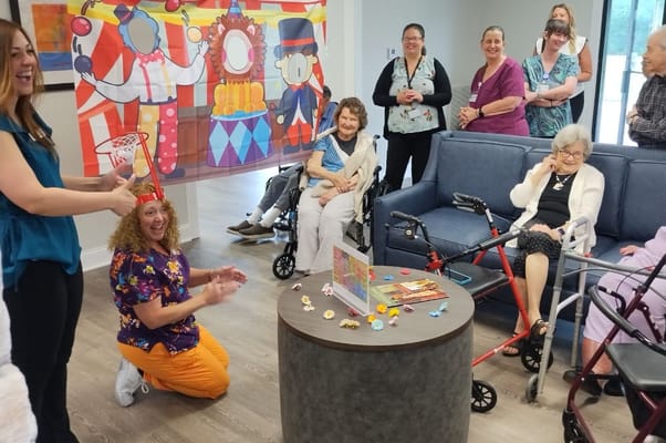 Residents and staff enjoying an activity in a common area