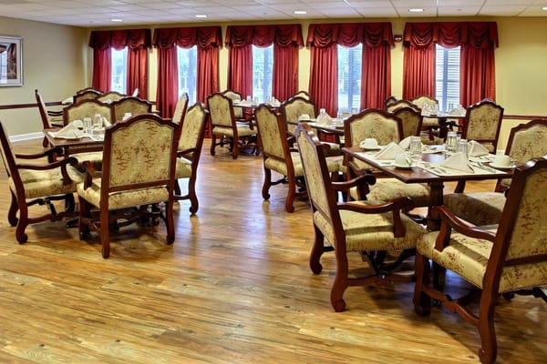 Elegant dining area with well-set tables and chairs