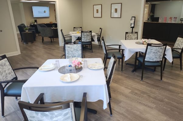 Bright dining area with tables set for meals