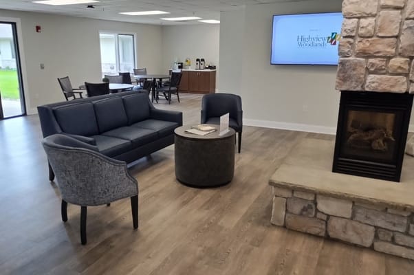 Interior common area with seating and fireplace