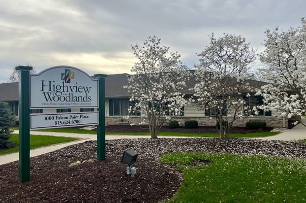Exterior view of Highview in the Woodlands with flowering trees