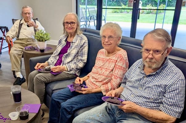 Residents enjoying dessert in a common area