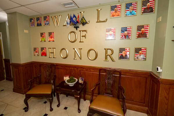 Interior view of the Wall of Honor with framed photos