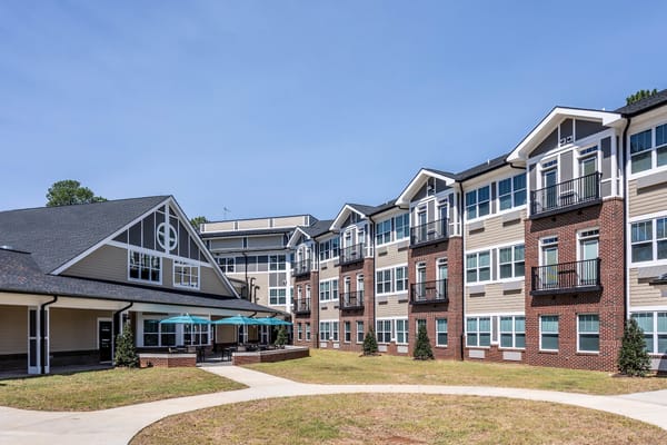 Exterior view of a senior living facility with courtyard