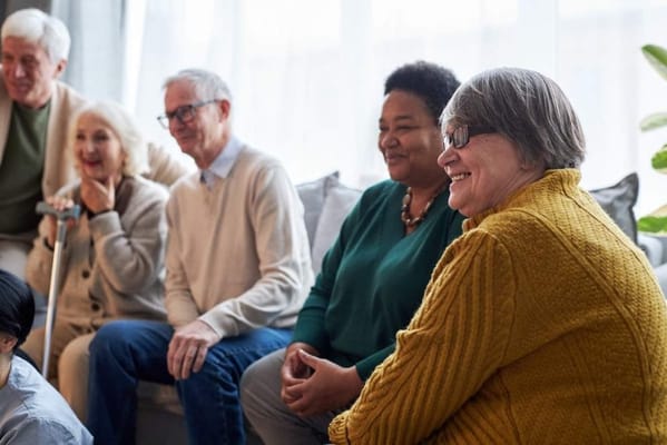 Residents engaging in conversation in a common area