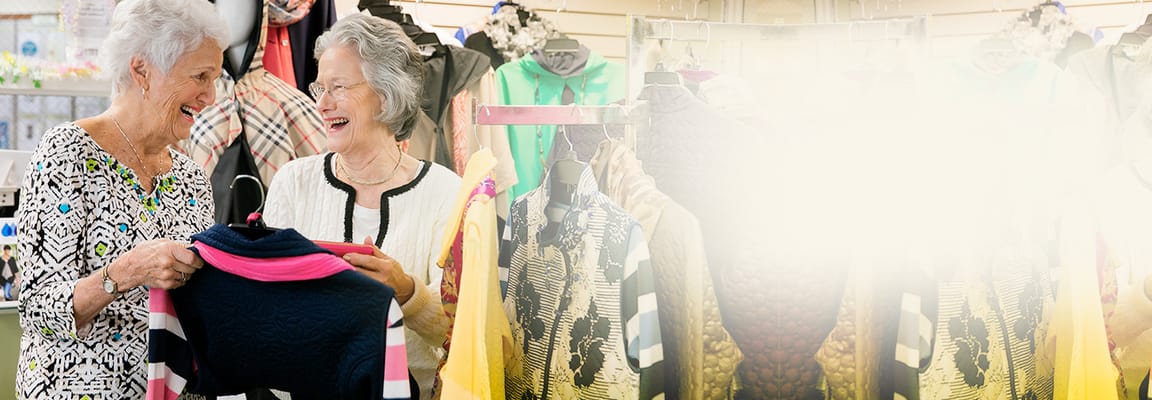 Two female residents shopping in a vibrant activity space