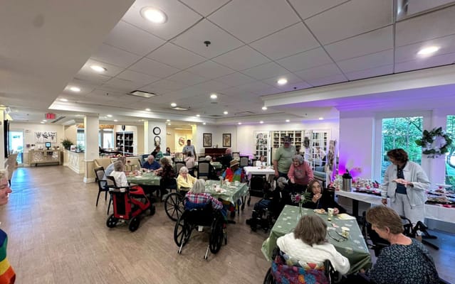 Residents enjoying a meal and socializing in the dining area
