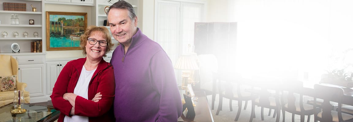 Couple smiling in a facility common area