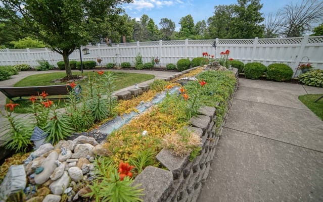 Well-maintained garden area with flowers and greenery