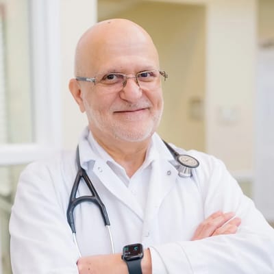 A doctor smiling in a healthcare setting