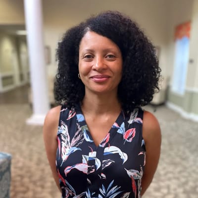 Staff member in a welcoming interior setting