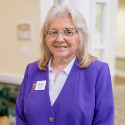 Staff member posing for a photo in the facility