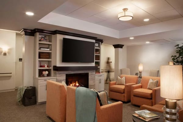 Cozy common area with comfortable seating and a fireplace