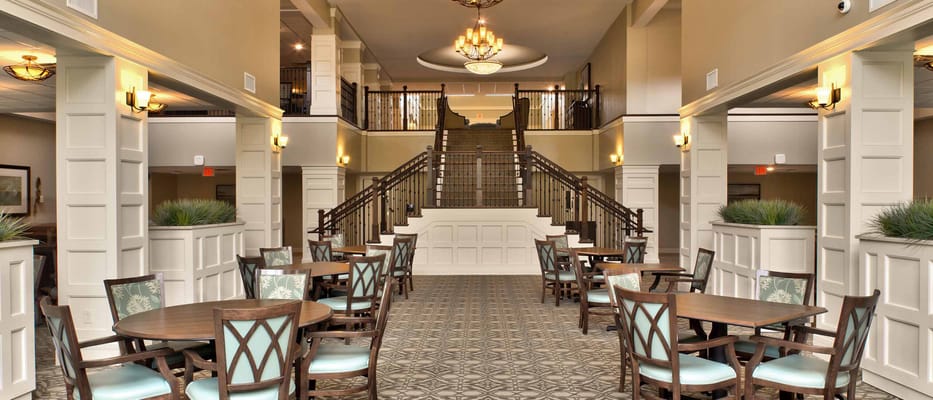 Bright lobby area with seating and staircase