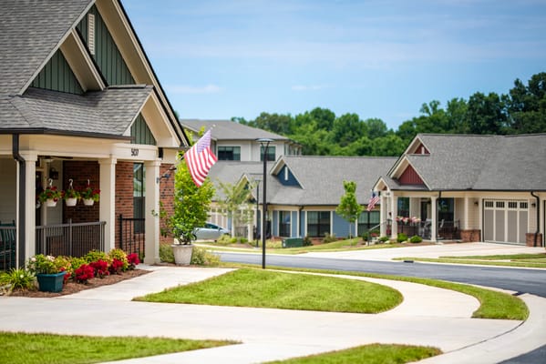 Beautiful outdoor pathway with American flags and flower planters