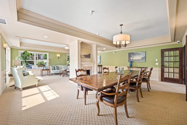 Bright common area with seating and dining table