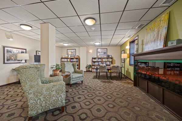 Cozy interior lounge area with bookshelves and seating
