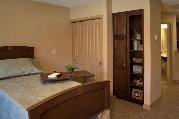 Cozy private resident room with bedside table