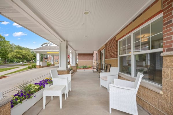 Outdoor seating area with flowers and chairs