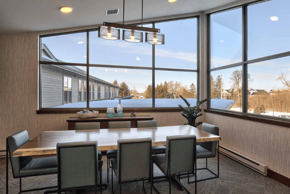 Bright dining area with large windows and modern decor