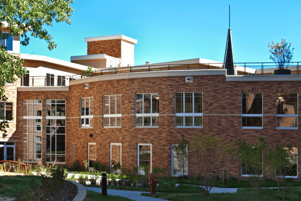Exterior view of the Highland Path building with landscaping