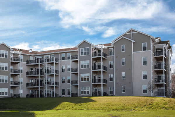 Exterior view of a senior living facility with balconies