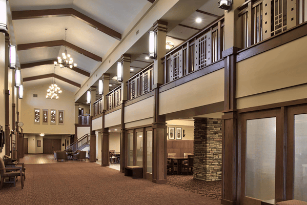 Interior view of a spacious common area in a senior living facility
