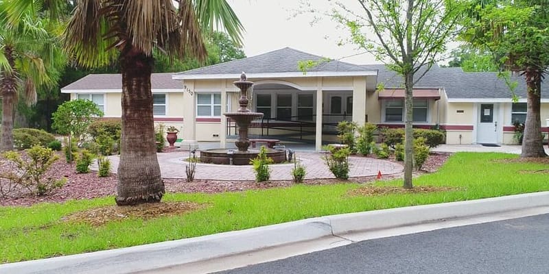 Exterior view of the assisted living facility with landscaping