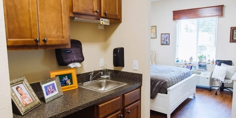 Private resident room with kitchenette and bedroom area