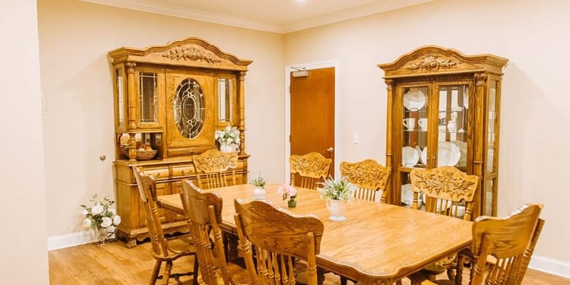 Bright dining area with wooden furniture and decor
