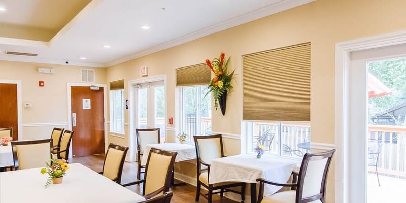 Bright dining area with tables and chairs