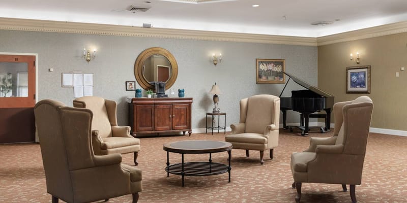 Common area with chairs and a piano