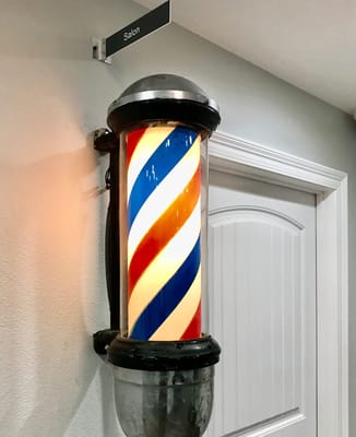 Barber pole indicating the facility salon