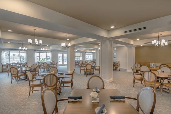 Dining area with elegant seating and lighting