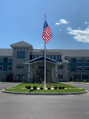 Exterior view of Clarendale of St. Peters with flag