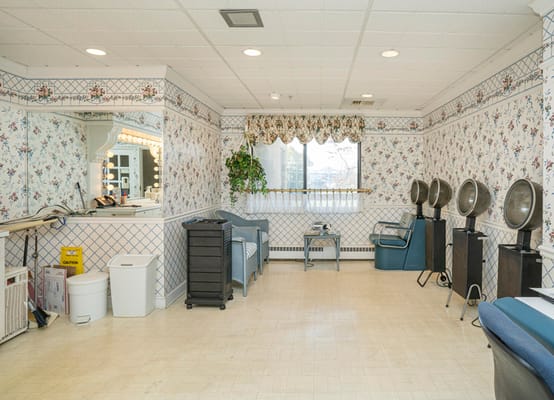 Interior view of a hair salon with styling chairs