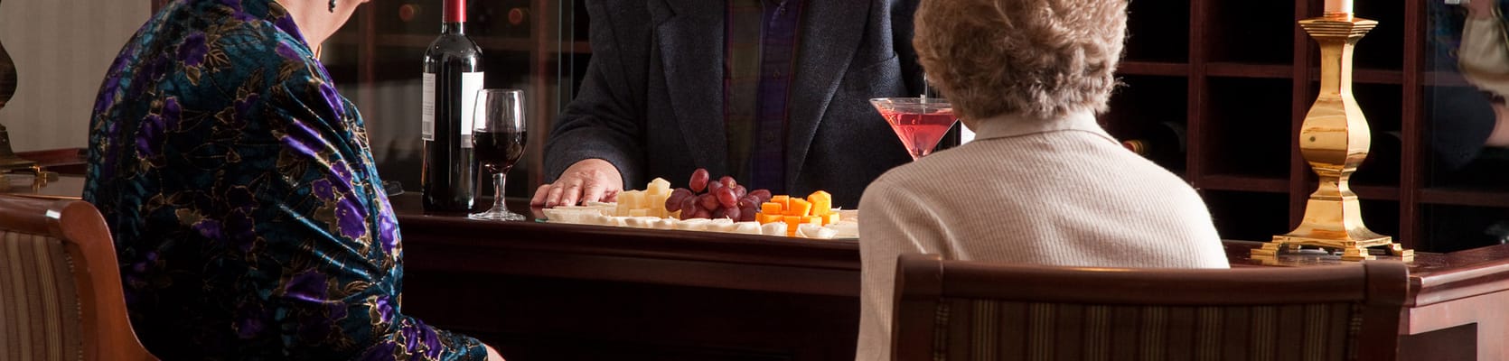 Two residents enjoying drinks at a bar