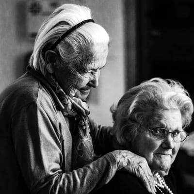 Two elderly women enjoying each other's company