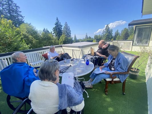 Residents enjoying an outdoor activity on a terrace