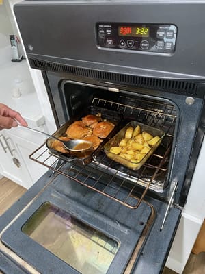 Food being prepared in an oven at a facility kitchen