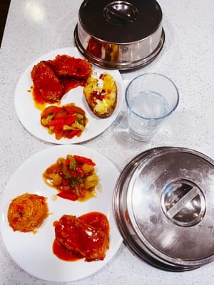 Meals served on plates with covered dishes