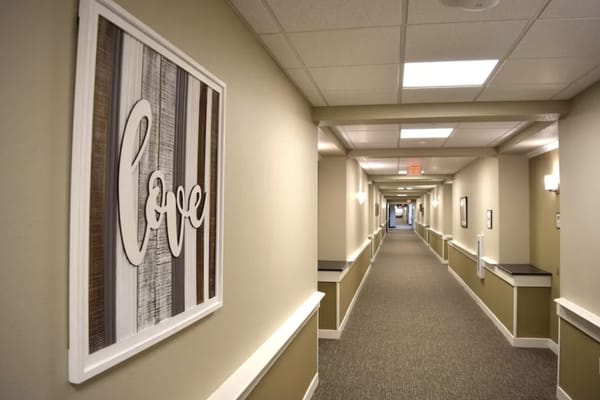 A hallway with decor stating 'love'