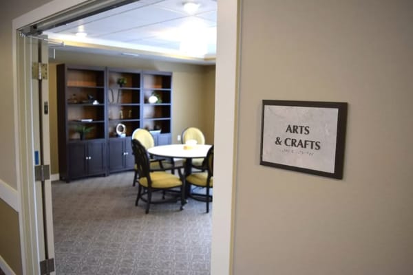Arts and crafts room with a table and chairs