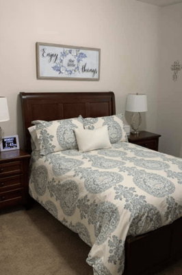 Cozy bedroom with a decorative bedspread and lamps