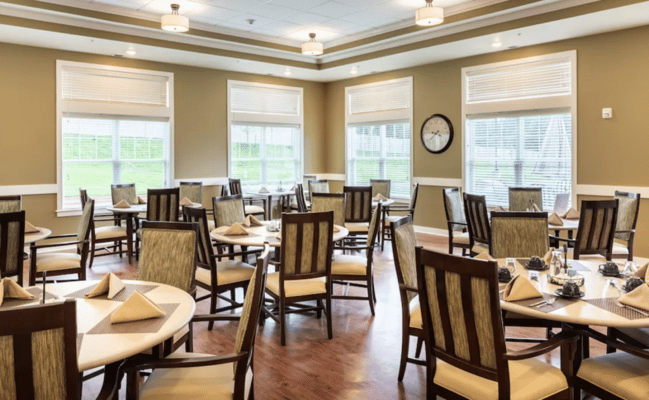 Dining room with neatly set tables and natural light