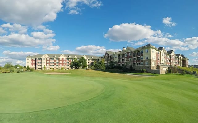 Exterior view of GreenFields of Geneva surrounded by grass