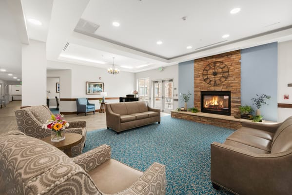 Cozy common area with seating and a fireplace