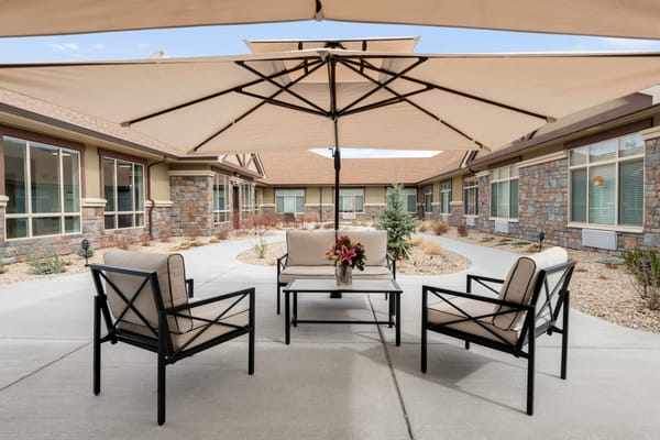 Outdoor seating area with comfortable chairs and table